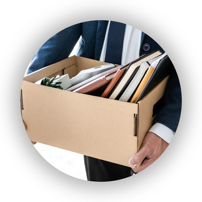 Man carrying box of work items - redundancy