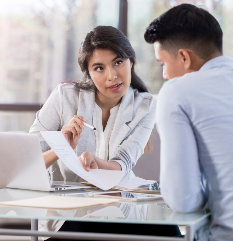 Two professionals reviewing policies