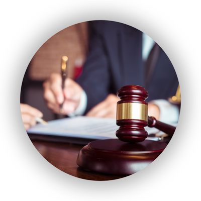 Gavel and two people writing