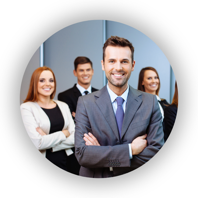Image of a male professional, smiling, with other professional men and women smiling behind him
