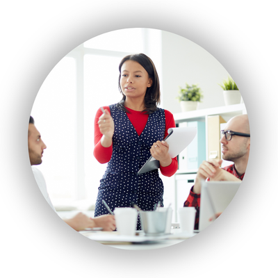 Professional talking to a room of her colleagues