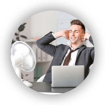 Office worker trying to get cool with a fan