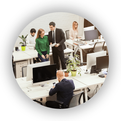 Manager amongst workforce - office with rows of desks