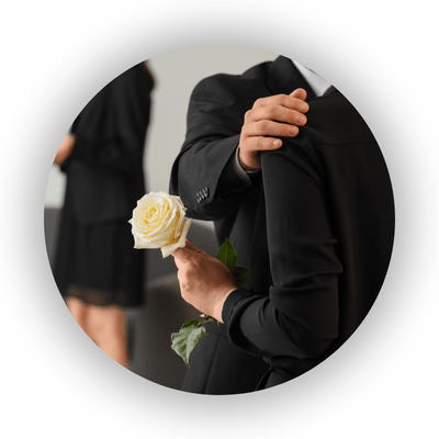 Person offering comfort to another at a funeral