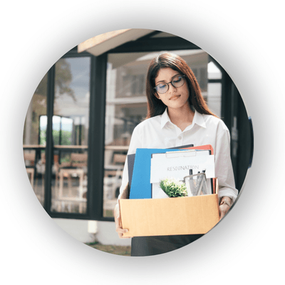 Woman carrying her work items in a cardboard box