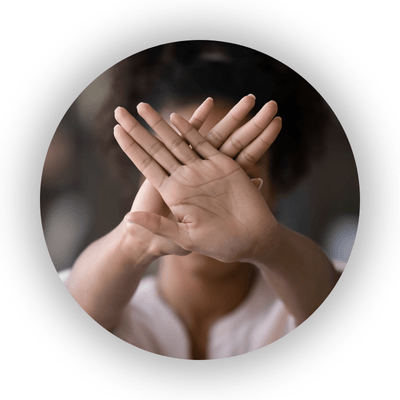 Person putting hands in front of their face to indicate 'stop'