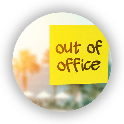 Out of office written on a yellow sticky note